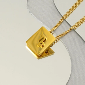 Square zodiac pendant necklace in gold stainless steel with a mirror reflection background