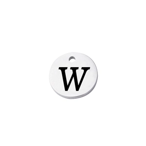 Macro view of mirror-polished stainless steel round charm with engraved capital letter W