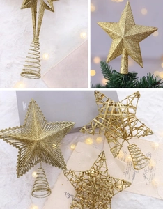 Detail of glitter gold Christmas tree toppers with solid, woven, and hollow star designs