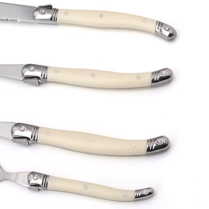 Detailed view of 4-piece stainless steel cutlery set with ivory ABS handles and bee motif