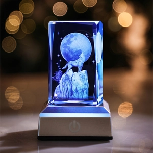 Detailed view of 3D laser engraved crystal block featuring a wolf howling at the moon