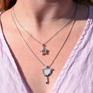 Barbie-style silver necklace with heart mirror and star charms with pink gems