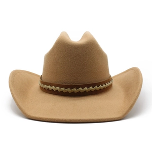 Detail of camel wool felt cowboy hat featuring a braided brown and beige decorative band