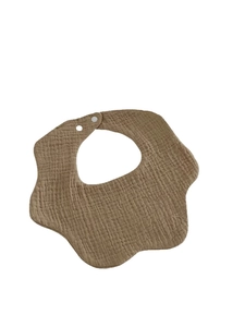 Absorbent brown cotton baby bib with petal shape and wrinkle texture on white background