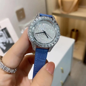 Luxury women's quartz watch with full crystal bezel, silver case and blue leather strap