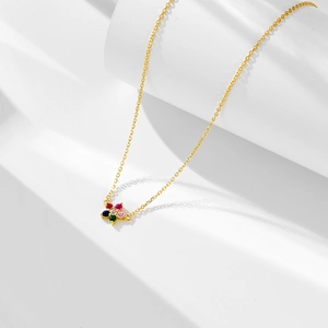 Close-up of golden s925 necklace featuring a five-petal flower pendant with colorful zircons