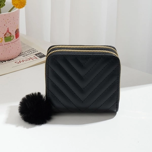 Black V-quilted faux leather wallet with double zippers and soft pompom charm
