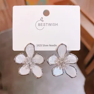 Close-up of five-petal flower earring with pearlescent resin and S925 silver needle