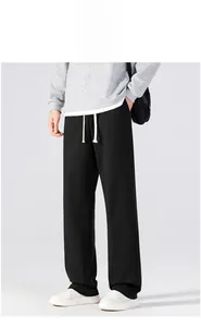 Detail of men's summer ice silk pants showing elastic waist and white contrast drawstring
