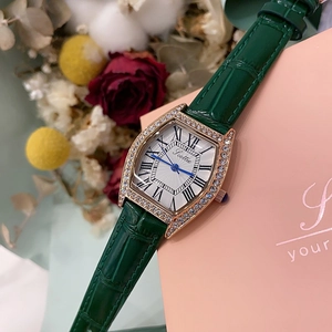 Detail of green leather watch with rose gold barrel case and crystals in gift setting