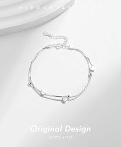 Close-up of S925 sterling silver double-layer bracelet with heart charms and lobster clasp