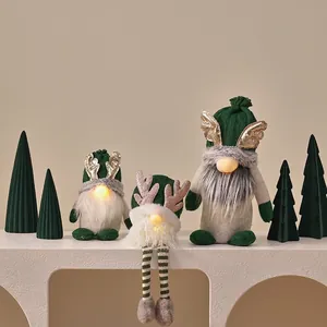 Three-piece glowing green Christmas gnomes with warm LED lights and reindeer antlers