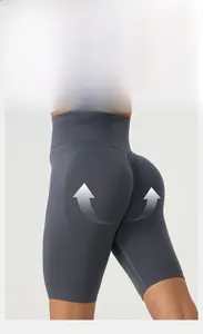 Detail of high waisted grey yoga shorts featuring scrunch butt and peach lifting texture