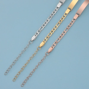Detailed macro of stainless steel Figaro bracelets in silver, gold, and rose gold finishes