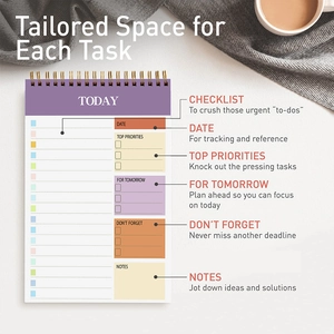 Detailed view of the daily spiral planner notebook featuring organized sections for tasks and notes.