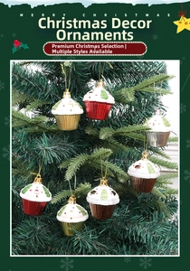 Cupcake-shaped Christmas ornaments with glitter details hanging on a green Xmas tree