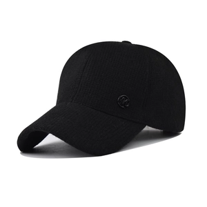Women's black ribbed knit baseball cap with small metal M logo in a side view