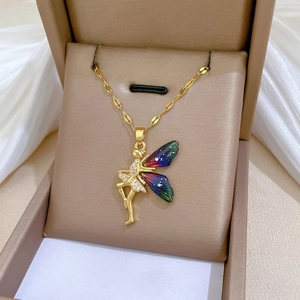 Detailed macro view of fairy wing pendant with rhinestones and colorful gradient enamel