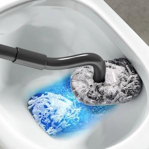 S-shaped toilet brush with long telescopic handle cleaning white ceramic bowl with foam