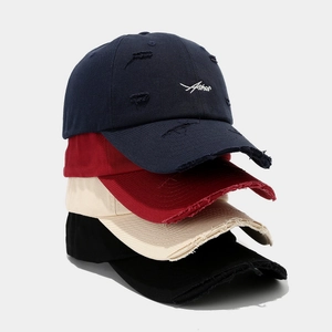 Vintage distressed baseball caps with embroidery and ripped details in four colors