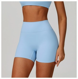 Close-up of high-waisted seamless yoga shorts in light blue with smooth compression fabric