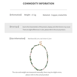 Detail view of malachite bead necklace with copper clasp and elegant white pearls