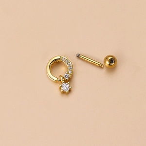 Detailed view of gold screw back earring with micro-pave cubic zirconia and shiny metal finish