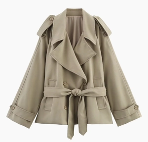 Detail of khaki trench coat featuring double-breasted buttons and adjustable waist belt