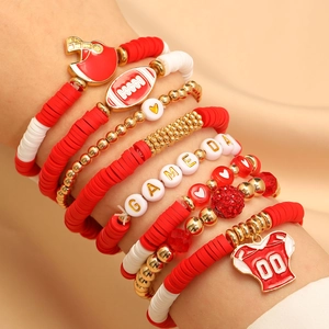 Detail of red and white Game Day football bracelets with helmet and jersey charms