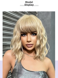 Front view detail of a shoulder-length wavy golden bob wig with stylish flat bangs