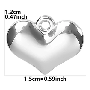 Detail showing dimensions of heart-shaped stainless steel pendant 1.5cm by 1.2cm