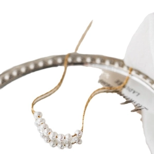 Minimalist titanium steel gold chain necklace featuring ten elegant white pearls