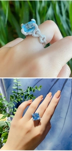 Detailed side view of luxury blue cushion cut gemstone ring with intricate pavé setting