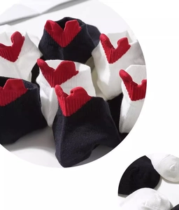 Close-up of cotton ankle socks featuring 3D red heart embroidery on the heels