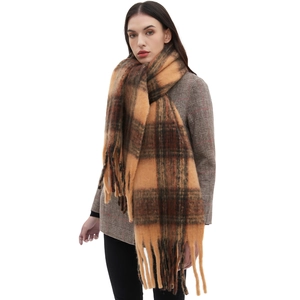 Thick autumn winter scarf with brown and orange plaid pattern and tassel fringe detail