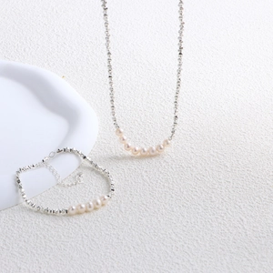 Elegant set with natural freshwater pearl necklace and irregular silver bead bracelet
