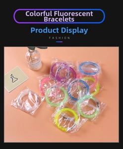 Flat lay of colorful LED glowing acrylic bubble bracelets with glitter for concert events