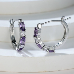 Silver hoop earrings with purple oval stones and white zircons in a polished finish