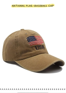 Detail of embroidered American flag and USA letters on washed khaki baseball cap