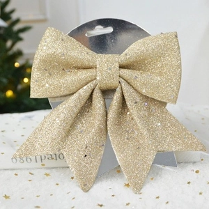 Sparkling gold sequin Christmas bow decoration for holiday trees and festive gifts