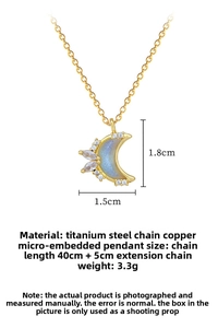 Macro shot of titanium steel moon necklace with colorful inlay and zircon details