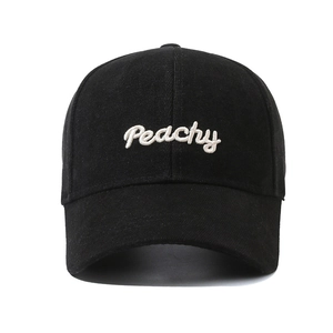 Classic black cotton baseball cap with white Peachy embroidery and curved brim