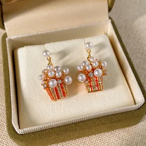 Exaggerated popcorn pearl earrings with zircon inlay in gold plated finish