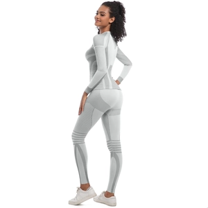 Detail of grey seamless yoga set showing geometric knit patterns and breathable texture