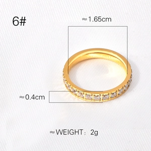 Gold eternity ring with cubic zirconia stones showing size, width and inner diameter