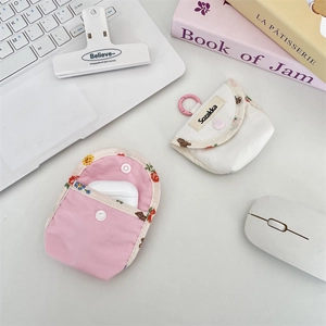 Floral fabric pouch for earphones with bear pattern and snap closure detail