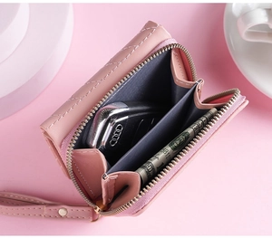 Pink quilted short wallet for women, stylish zipper coin purse with wrist strap and card slots.