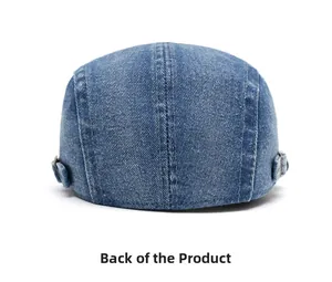 Detail view of denim beret back featuring metal side buckles and premium stitching