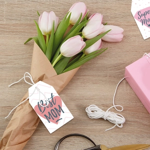 Detail of pink heart gift tags on tulip bouquet for Mother's Day decoration