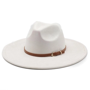 Detail of cream faux suede fedora featuring a brown leather band and gold buckle